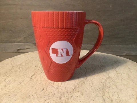 NEBRASKA CORNHUSKERS SWEATER COFFEE MUG CUP SPORTS KITCHEN NEW 10 OZ. LARGE Cover