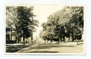 Ionia Michigan, vista a la calle, coches, pequeña estación de servicio, postal de 1944 RPPC - Imagen 1 de 3