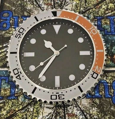 Reloj de pared LUJO naranja y plateado con esfera negra Foto 1 de 3