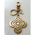 Porte-clés fleur dorée authentique Louis Vuitton Cles M64276 or charme argent