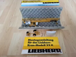 Liebherr 32 K gru a intervento rapido gru da arrampicata gru per costruzioni edili gru Conrad 1:50 IMBALLO ORIGINALE - Foto 1 di 3