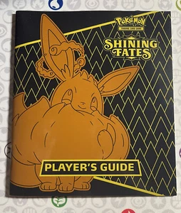 Shining Fates Player's Guide Pokémon JCC Espada y Escudo (contiene Lista de Cartas) - Imagen 1 de 2