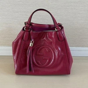 Auténtico bolso de mano de hombro GUCCI SOHO con borla bidireccional GG cuero rosa para mujer - Imagen 1 de 16