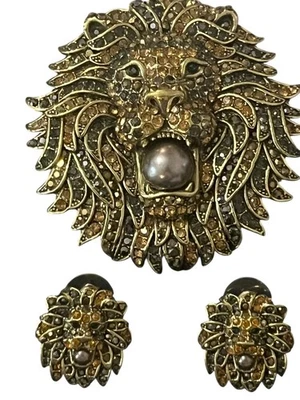 Juego de pendientes y broches perforados de cristal de Swarovski Heidi Daus LION LEGEND Foto 1 de 4