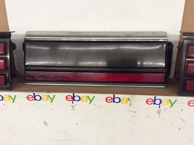 Pontiac 84-89 6000 Tail Light Finish Center Panel 1984 1985 1986 1987 1988 1989  - Image 1 of 2