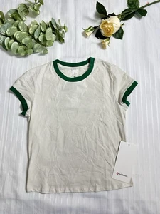 NUEVO CON ETIQUETAS $48 Camiseta de bebé Lululemon de algodón orgánico para mujer - LTIV/RCGR - Talla M - Imagen 1 de 7