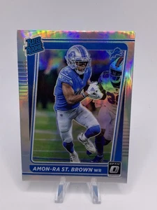 2021 Donruss Optic Amon-Ra St. Brown Silver Holo Prizm RC Rated Rookie Lions - Bild 1 von 2