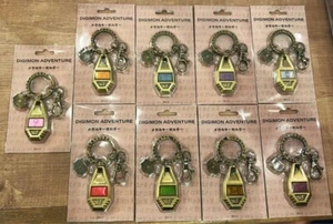 Portachiavi Digimon Adventure Crest in metallo set completo di 9 - Foto 1 di 14