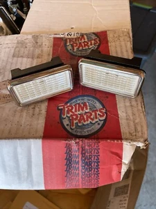 1968 1969 CHEVY CORVETTE FRONT SIDE MARKER LIGHTS TRIM PARTS 20858280 NEW - Picture 1 of 5