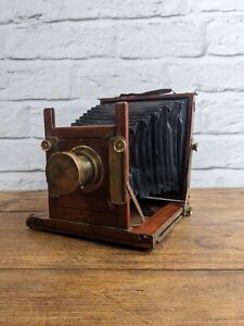 Mahogany Bellows Plate Camera with wooden tripod and plates