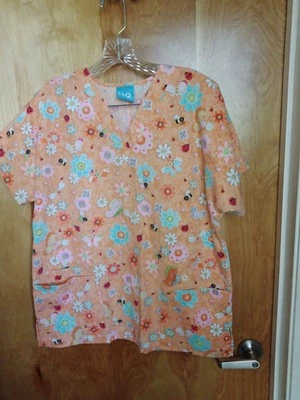 CAMISA EXFOLIANTE MUJER H Q EXFOLIANTE TALLA PEQUEÑA MELOCOTÓN CON FLORES Y MARIPOSAS Foto 1 de 2