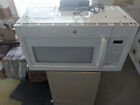 General Electric® White 1.6 Cubic Feet Over-the-Range Kitchen Microwave Oven photo