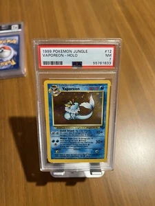 1999 Vaporeon 12/64 Jungle Unlimited Holo PSA 7 NM - Picture 1 of 4