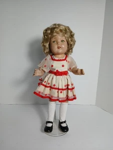 Bambola di porcellana vintage Shirley Temple con vestito occhi verdi capelli biondi vecchia JNY - Foto 1 di 21