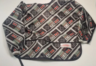 Baberos impermeables con mangas Bumkins Nintendo NES 6-24 meses LICENCIA OFICIAL Foto 1 de 4