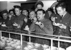 troops enjoying cake and icecream in a Brussels store during - 1944 Old Photo 1