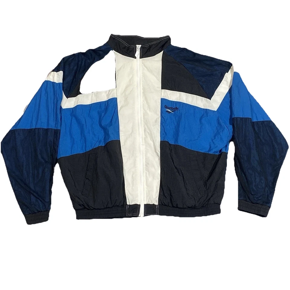 Chaqueta cortavientos vintage Reebok para hombre grande azul marino blanco bloque de color cremallera completa años 90 Foto 1 de 4