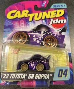 2025 CAR TUNED JDM SERIE 1 #04 2022 TOYOTA GR SUPRA VIOLA 1:64 AUTO - Foto 1 di 5