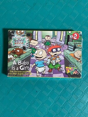 RUGRATS MOVIE A Baby is a Gift Cassette 1998 Blockbuster Play Pak NEW SEALED Foto 1 de 2