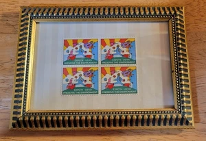 Gerahmtes Set mit vier Expo'74 Briefmarken, entworfen von Peter Max - Bild 1 von 2