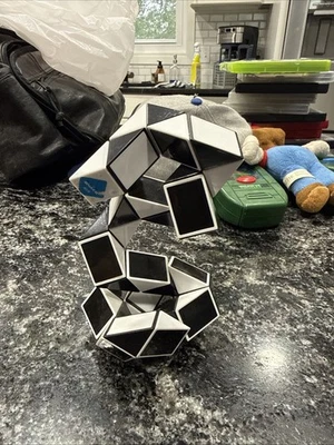 Magic Snake ~ Black ~ Twisty Puzzle Nostalgic Toy Create Endless Shapes - Image 1 of 4