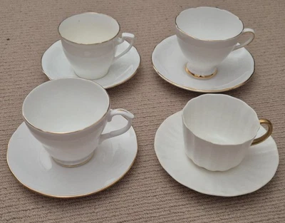 VINTAGE WHITE & GOLD TEA CUPS & SAUCERS - AYNSLEY, ROYAL DOULTON, DUCHESS, ETC - image 1 of 4
