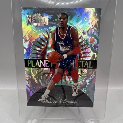 Hakeem Olajuwon 1997-98 FLEER METAL UNIVERSE PLANET METAL #12 - Image 1 of 2
