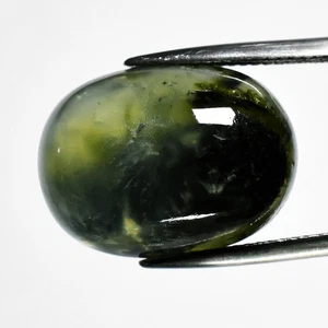π 23.68ct Oval Cabochon Natural Green Prehnite with Black Needles - Africa Gem - Picture 1 of 4