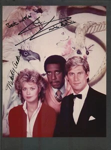 Melody Anderson & Simon MacCorkindale - Foto a color autógrafa firmada - Manimal - Imagen 1 de 1