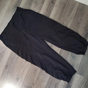 Pantalone Athleta donna taglia 2 nero abbigliamento sportivo lounge tasche con cerniera elasticizzato - Foto 1 di 10
