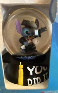 DISNEY STITCH MUSICAL WATERGLOBE GRADUATION **NEW** - Picture 1 of 4