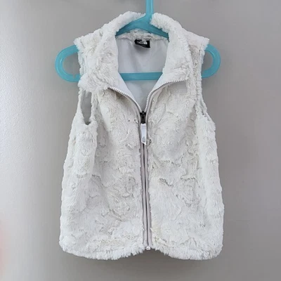 Chaleco de piel The North Face para niñas talla 5 usado en excelente estado Foto 1 de 4