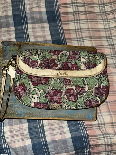 Pochette da polso Coach in tela disegno floreale bordo oro