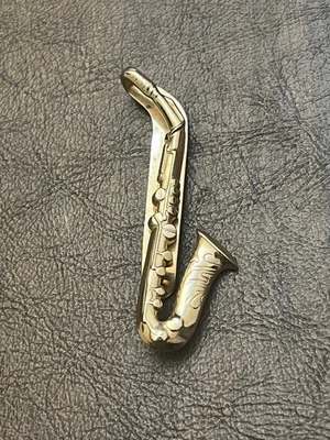 Clip de corbata de saxofón vintage Swank tono dorado Foto 1 de 4