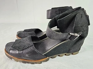 Sorel Joanie II Black Leather Wedge Heels Sandals Ankle Strap Back Zip Size 7.5 - Picture 1 of 12