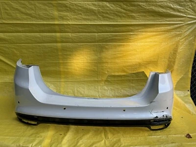 PARAGOLPES TRASERO FORD FUSION 13-18 DOBLE ESCAPE CENEFA PLATINO OEM  Foto 1 de 4