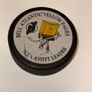 New Jersey Devils Official NHL Hockey Puck 1990s Bell Atlantic Yellow Pages - Picture 1 of 2