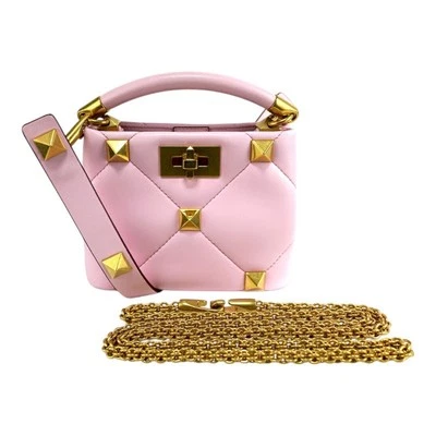 Bolso Valentino Garavani Rosa Acolchado Cuero Mini Tachuelas Romanas Asa Superior Foto 1 de 4