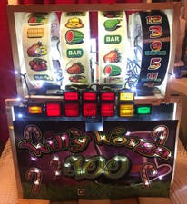 Upcycled fruit machine reels buttons and a poster
