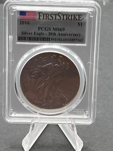 2016 USA $1 Silver Eagle Coin Graded MS69 by PCSG - First Strike - Picture 1 of 5