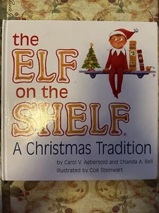 DIE ELFE IM REGAL EINE WEIHNACHTSTRADITION NUR HB BUCH! BRAUN HAAR BRAUEN AUGE JUNGE - Bild 1 von 4