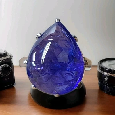 Anillo de compromiso vintage de platino 22,02 quilates con forma de cabujón de pera tanzanita natural  Foto 1 de 4