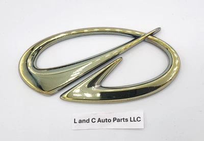 2002-2004 OLDSMOBILE BRAVADA FRONT BUMPER GOLD EMBLEM SYMBOL BADGE OEM - Image 1 of 4