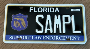 Placa DMV de muestra de aplicación de la ley de apoyo de matrícula de Florida - Imagen 1 de 2