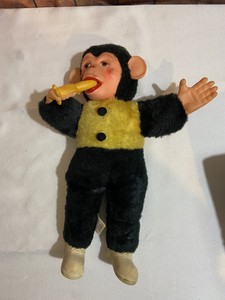 old monkey toy with banana