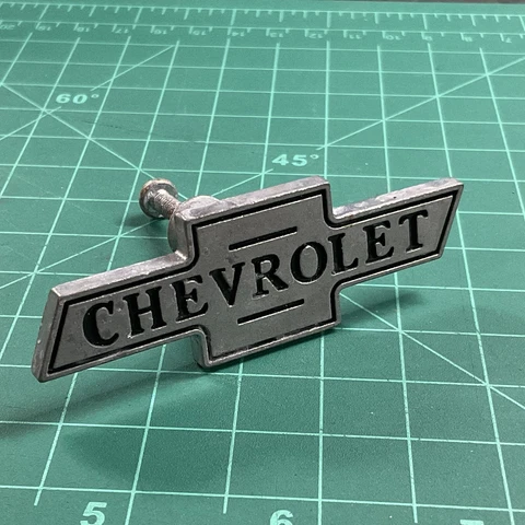 Chevrolet Drawer Cabinet Knob Pulls Brushed Metal with Black Background - One Cover