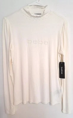 bebe Woman's Ivory Beaded Logo Long Sleeve Mock Turtle Neck Top L NWT - Image 1 of 4