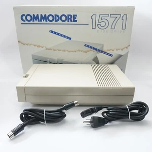 COMMODORE 64 128 PC ORDINATEUR 1571 DISQUETTE DISQUE LECTEUR + câbles et boite - Photo 1/9