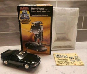 Super GoBots Herr Fiend Enemy Robot auto sportiva con scatola 1984 Tonka Porsche 7252 - Foto 1 di 24
