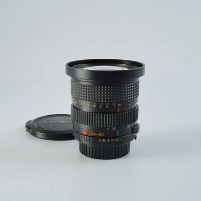 AS-IS MINOLTA MD ZOOM 24-50mm F/4  Zoom Lens - Image 1 of 4